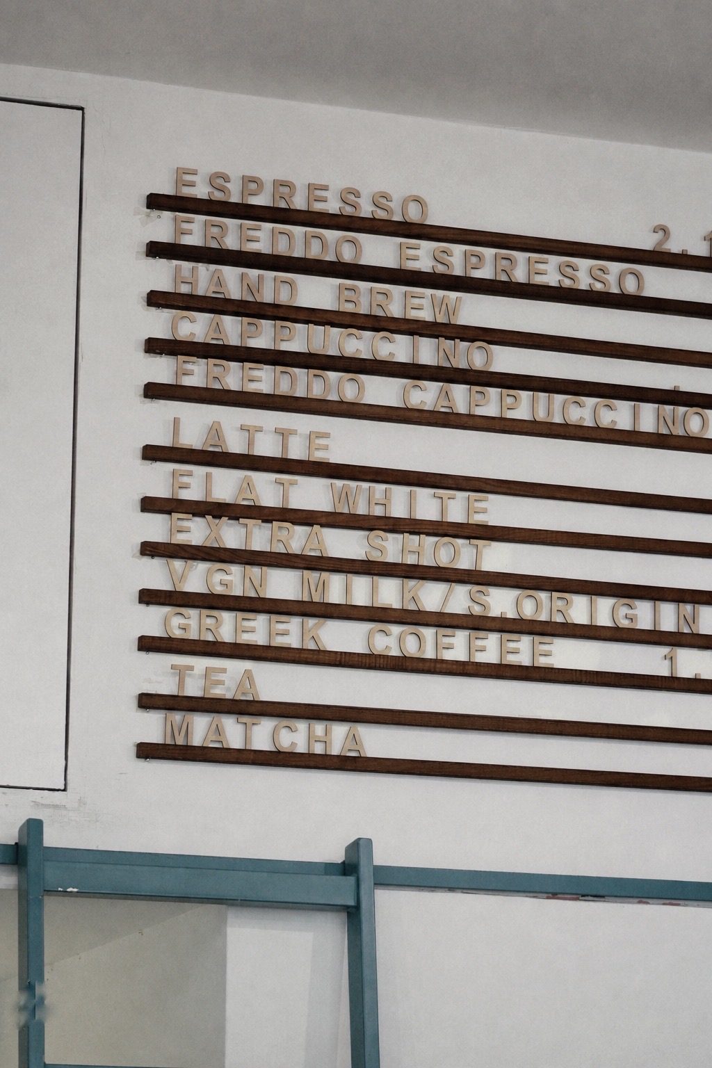 Cherry's wall menu — from freddo to filter, oat to Greek